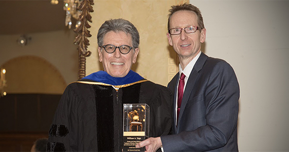 William Vega presented chair award by Provost Michael Quick