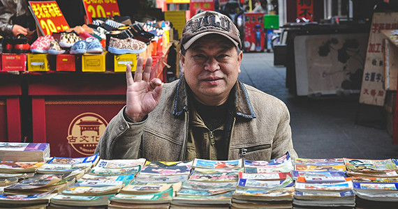 older Chinese man selling items