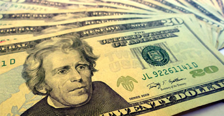 twenty-dollar bills spread out on a table