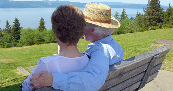 Older couple sitting outdoors on a bench