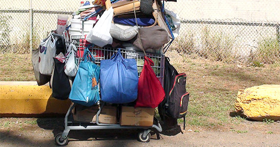 Shopping cart with person's belongings