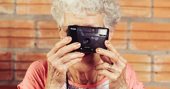 Older women takes photo with camera