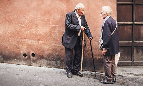 Older adults talking in the street
