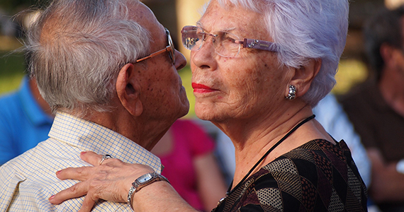 Older Latino couple dancing