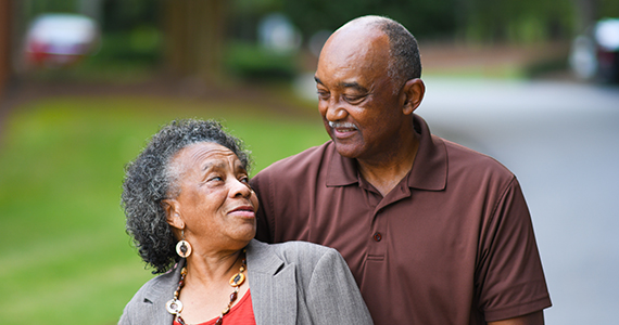Older African American Man and woman posing together