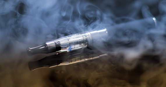 e-cigarette and smoke on a table