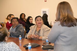 people listening to a speaker in a seminar