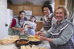 Photo of smiling family cooking together