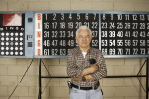 Man in front of a bingo board