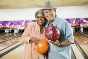 Photo of a smiling couple bowling