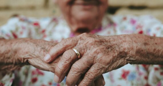 a close-up of an elderly man's hands